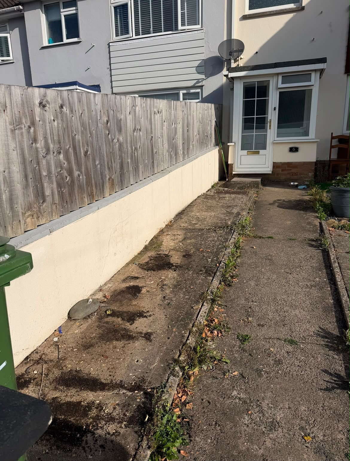 The same outdoor area clear and tidy after the work was completed
