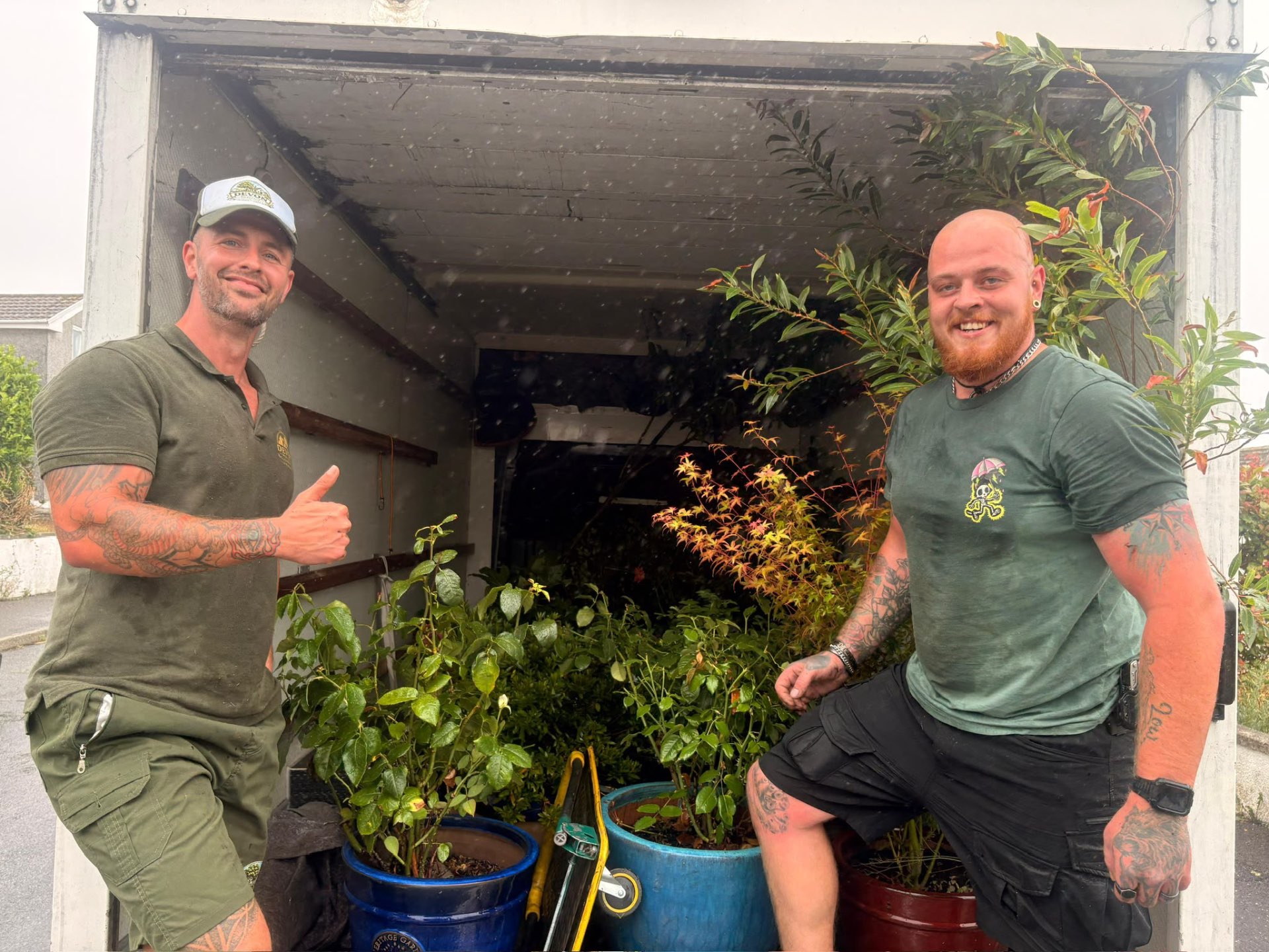 Two Devon Heritage Removals team members delivering plants for reuse